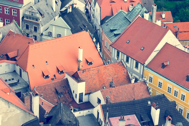 Roofs of houses with red tile in a beautiful old town view from above Toned