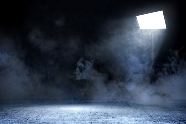 Room with concrete floor and smoke with light from spotlights, background