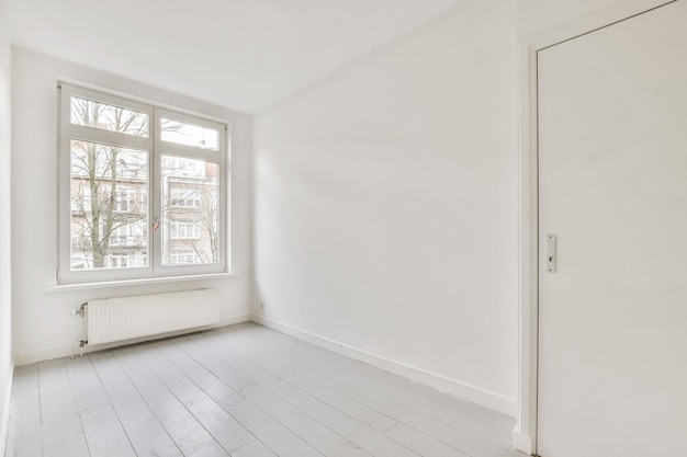 Room with door and parquet floor