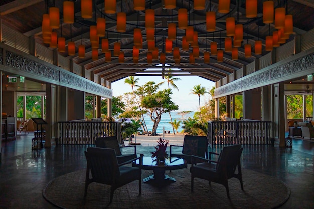 a room with a table and chairs and a sign that says  the name of the sea