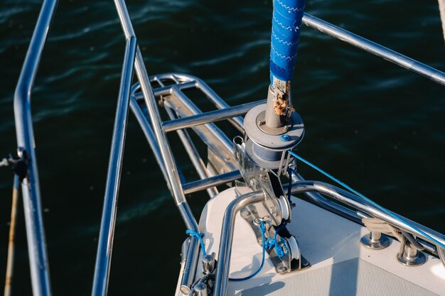 Rope on the winch of a white yacht in the sea.yacht equipment.