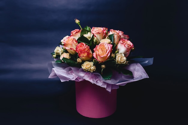 Rose cabaret in basket on dark background