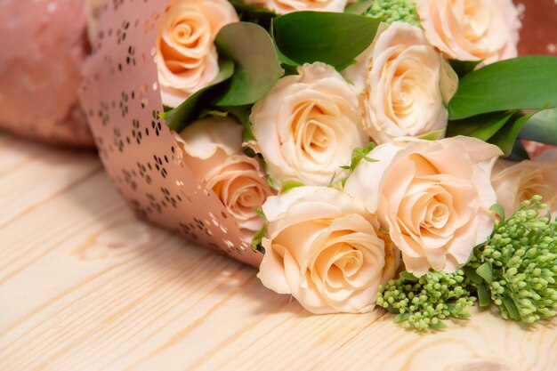 Rose flower on wooden table