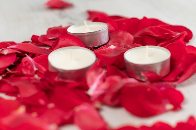 Rose petals and scented candles on the floor