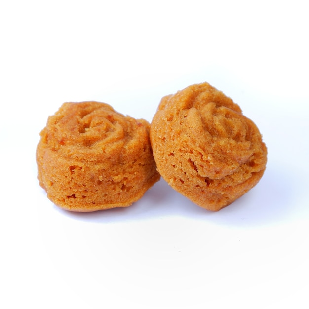 Rose shaped steamed sponge cake, Indonesian market snack. Isolated on a white background