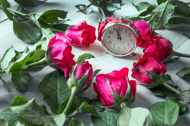 Photo rose on wood and clock for sell on valentine