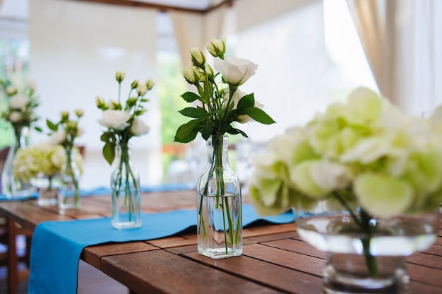 Roses in glass bottles