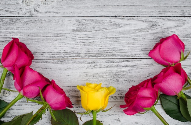 Roses on a wooden background