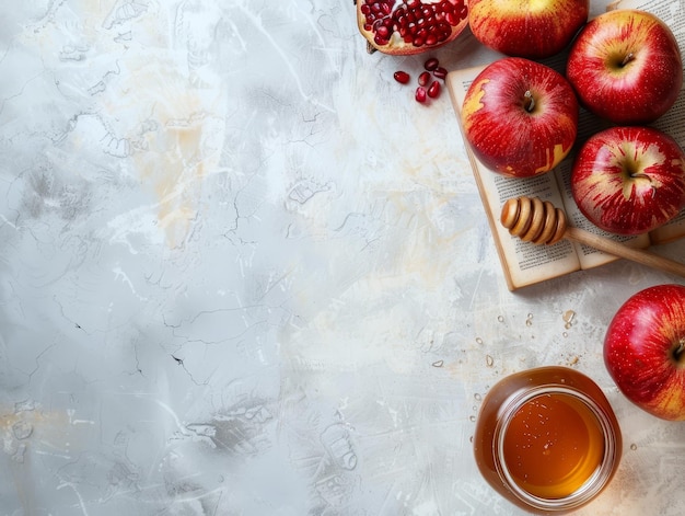 Rosh Hashanah Apples Honey and Pomegranate on Grey Background