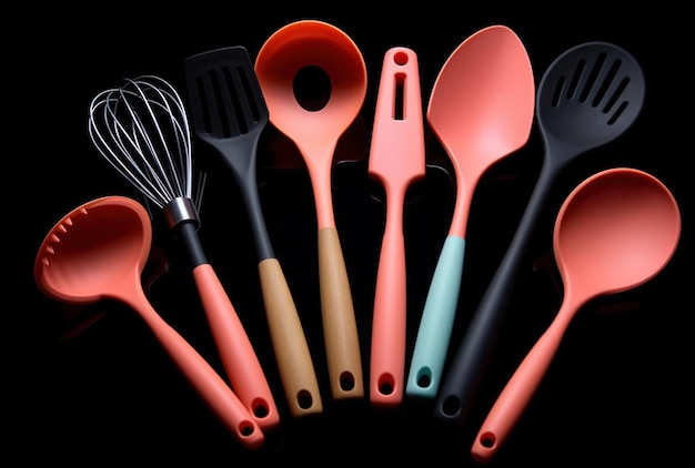 Rotation of silicone or rubber kitchen utensils on black background