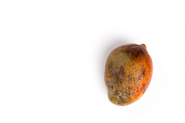 Rotten mango. Overripe Fruit on a white surface.Isolated