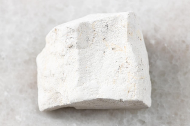 Rough Chalk stone on white marble