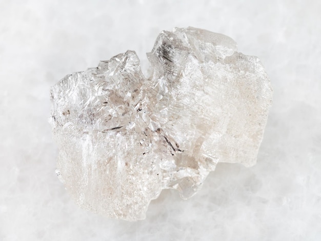 Rough crystal of Danburite gemstone on white