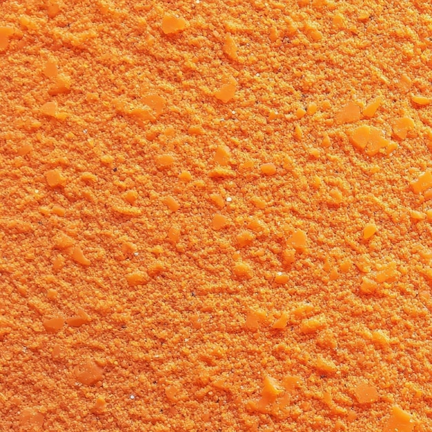 Photo rough sandpaper texture with bright tangerine surface