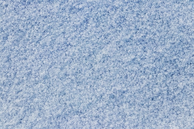 Rough texture of snow on ice Winter background