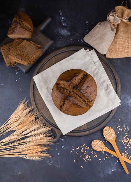 round black bread sliced bread and wheat