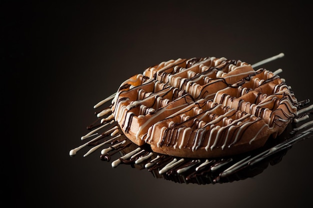 Round cookies on a dark background with reflection