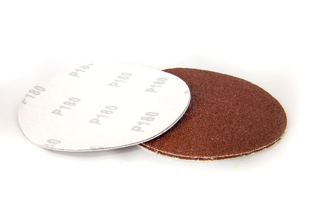 Round discs of sandpaper isolated on white