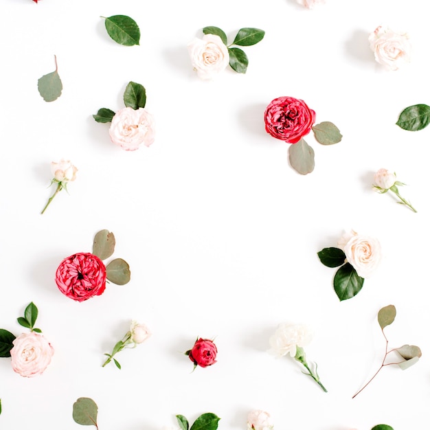 Round frame wreath pattern with red and beige rose flower buds, branches and leaves isolated on white