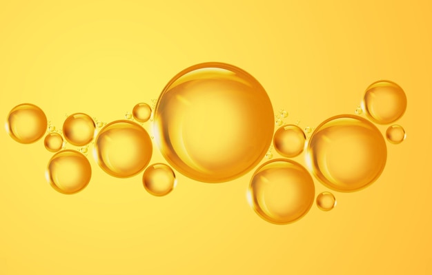 Round golden drops of oil or serum on yellow background