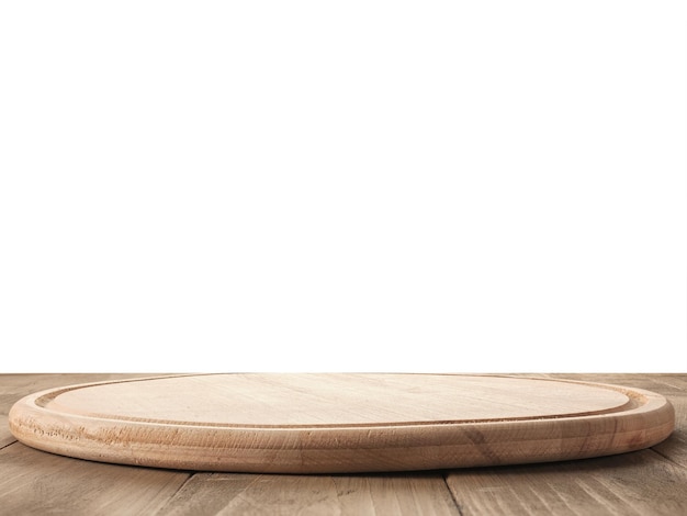 Round kitchen board on a table with isolated background very large depth of field