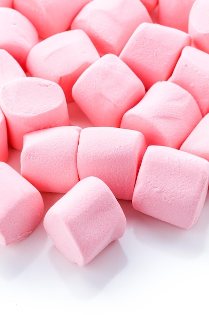 Round large pink marshmallows on a white backgrouns.