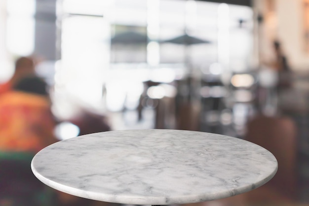 round marble table top with cafe restaurant bokeh lights abstract background for montage product display