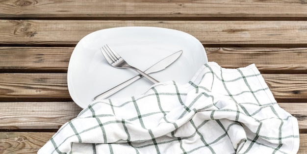 Round Plate with utensils and dish towel