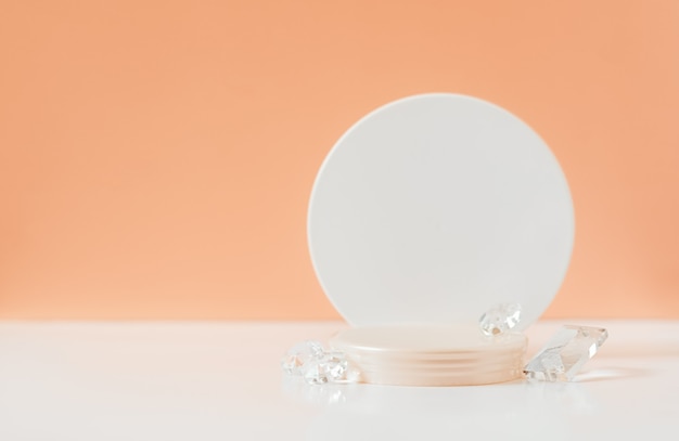 Round podium and glass beads on a scarlet background