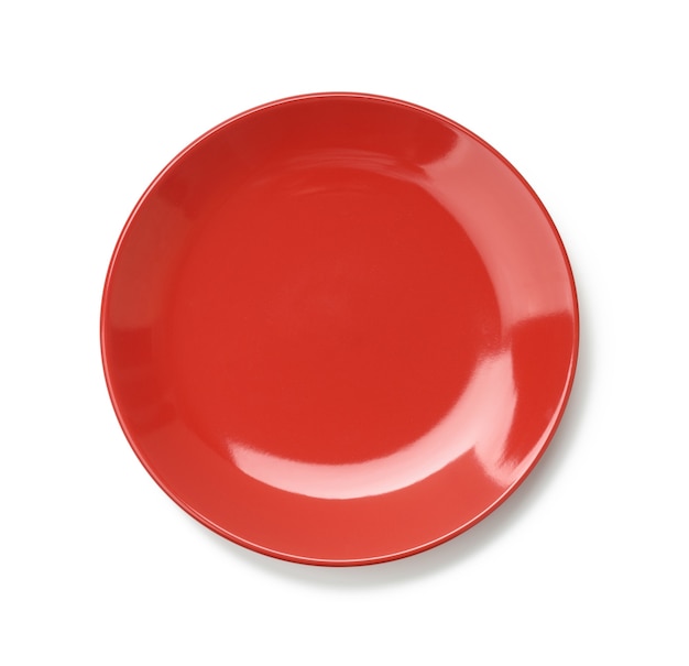 Round red plate for main courses isolated 