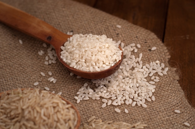 Round rice in wooden spoon.