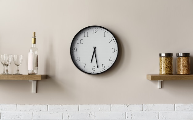 Round wall clock between wooden kitchen shelves