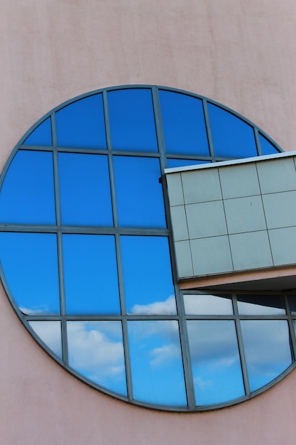 A round window with a blue sky in the background