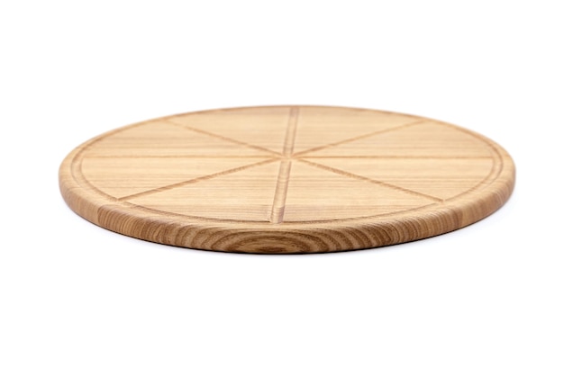 Round wooden pizza cutting board with slice grooves isolated on white background