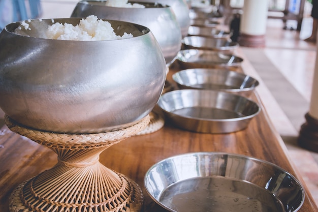 A row on buddhist monk's alms bowl, receive offering food