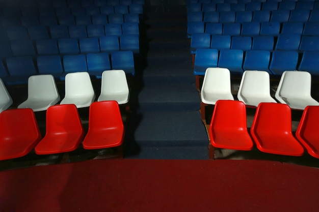 row of chairs in the room for spectators