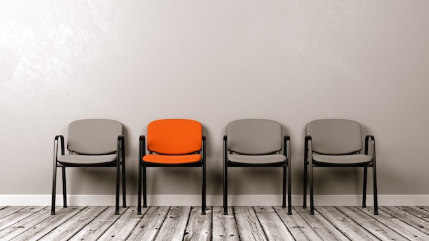 Row of Chairs on Wooden Floor Against a Wall