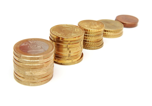 A row of coins with one being labeled with the other being a gold coin.