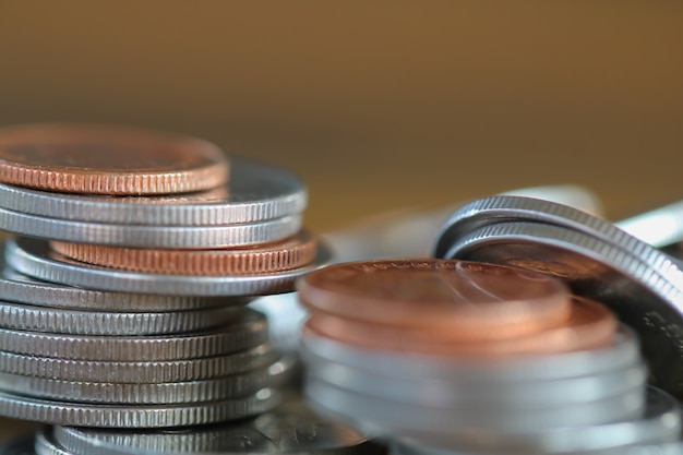 Row of coins on wood background for finance and Saving concept,Investment, Economy, Soft focus