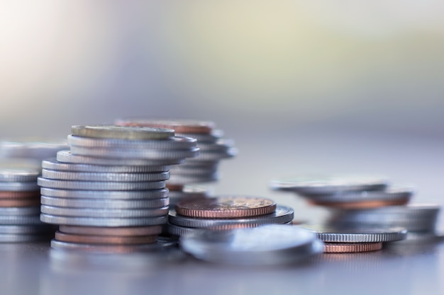 Row of coins on wood background for finance and Saving concept,Investment, Economy, Soft focus 