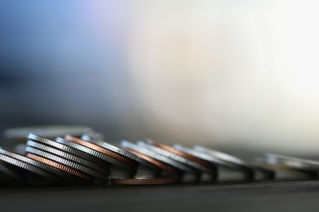 Row of coins on wood background for finance