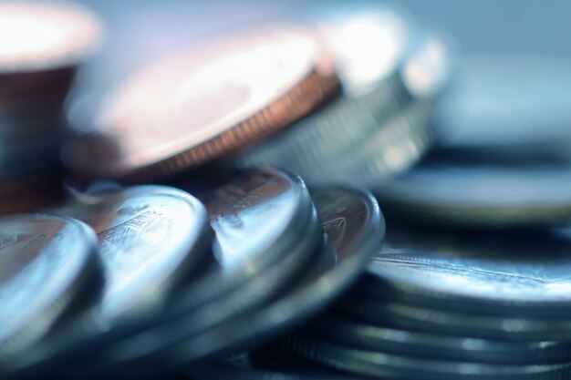 Row of coins on wood background for finance