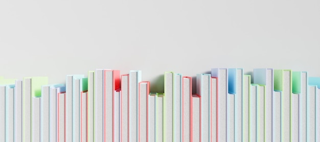 Row of colored books on a white surface