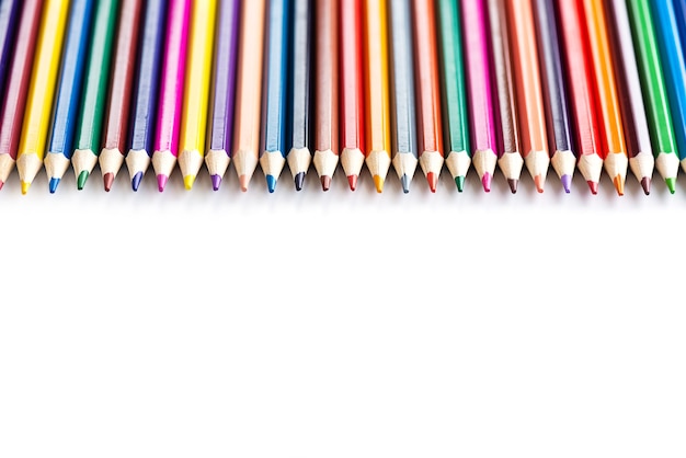 A row of colored pencils on a white background