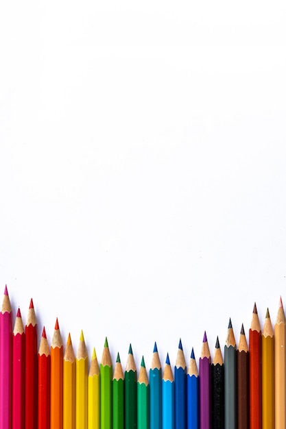 A row of colored pencils on a white background