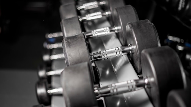 Row of dumbbell in fitness gym 