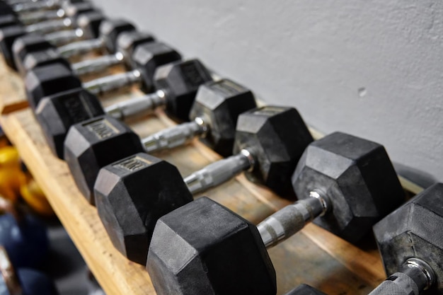 Row of dumbbells in gym