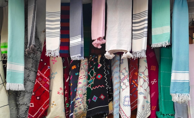 Row of elegante scarves hanging from a market display