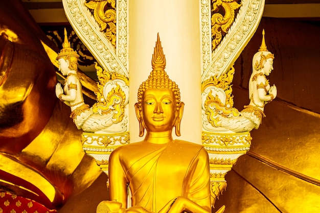 Row of Golden buddha statue in temple