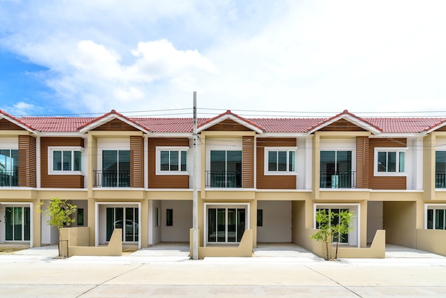 Row of just finished new brown townhouses.